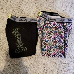 Two pair of softball slides